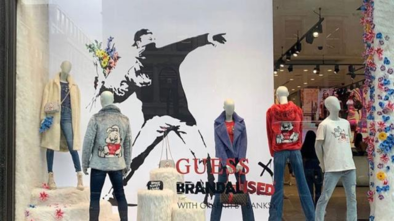 Banksy urged to steal in the Guess brand stores, who stole his copyright