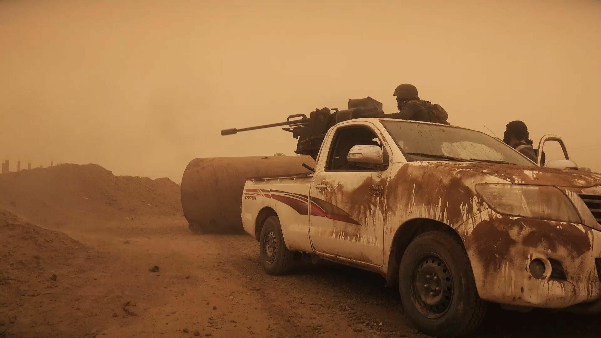 Пикап с пулеметом в сирийской пустыне - отнюдь не изобретение исламистов